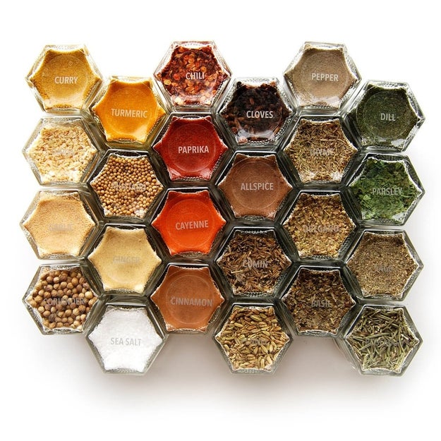 A magnetic spice rack that could almost double as a sculpture filled with organic herbs.