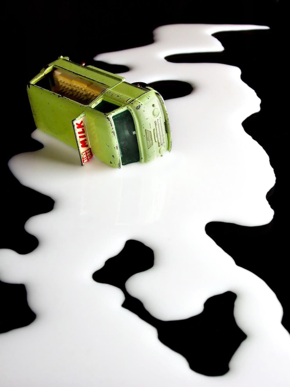 toy milk van in a puddle of milk