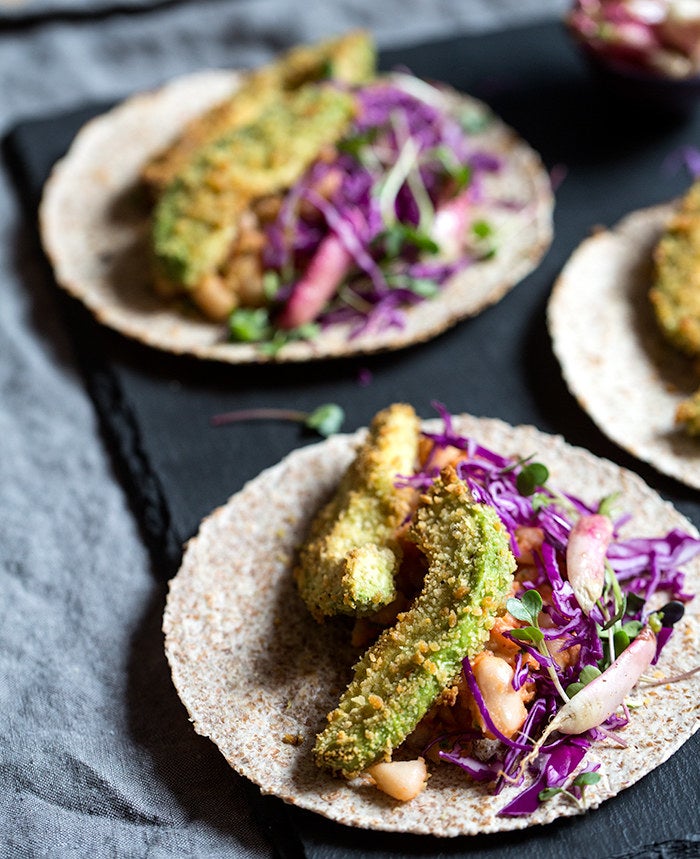 You can never have to many meat-free taco options. These baked and breaded avocados are crispy on the outside but creamy on the inside. Top them with smashed white beans and sriracha and call it a fiesta.